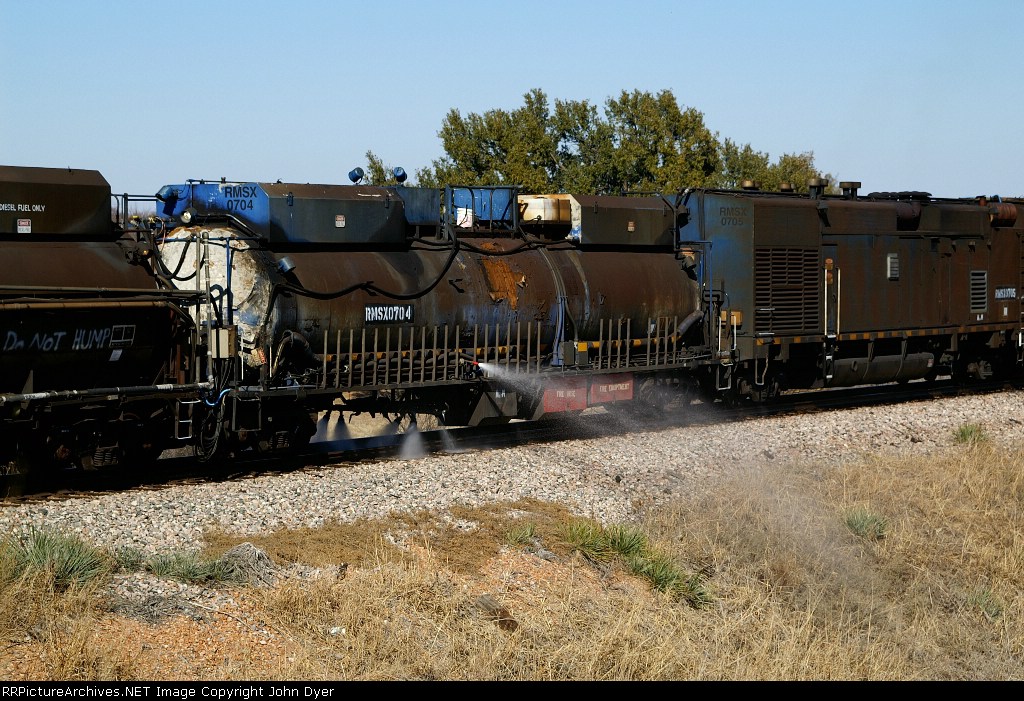 RMSX 704 spraying water and foam ahead ob the grinders